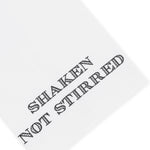 The Shaken Not Stirred Tip Towel by Haute Home features white cotton piqué fabric (20 x 25 cm) with "SHAKEN NOT STIRRED" hand embroidered in bold black letters.