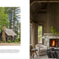 Left: The cover of Tradition Made New by Penguin Random House features a small stone cottage nestled among trees, highlighting exceptional craftsmanship and the use of natural materials. Right: Inside, a cozy living room with fireplace, armchairs, and tall windows is depicted, featuring wood walls and a vaulted ceiling that evoke architect Adams’ timeless designs.