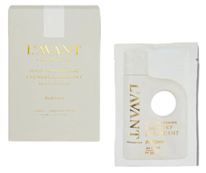 L'Avant Laundry Detergent Travel Pack by L'Avant Collective features a conveniently elegant pouch with a white label and gold text, highlighting its high-performing, plant-based formula in "Fresh Linen" scent. It's cruelty-free for guilt-free cleaning on the go.