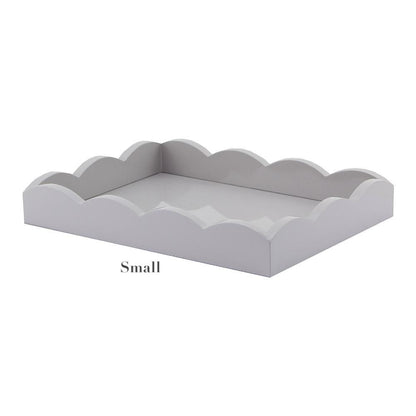 The Addison Ross Scalloped Chiffon Lacquer Tray Collection features small, rectangular trays with scalloped edges and a high-gloss lacquer finish, shown against a plain background.