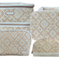 Four beige and white travel bags from the Paros Coconut Travel Collection by Stephanie Johnson are shown together, each with a woven diamond pattern, zip closures, and popular styles like the Jenny Train Case and Mae Mini Pouch.