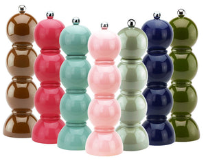 Five glossy Hive Bobbin Salt & Pepper Grinder Sets in brown, red, pink, light green, dark blue, and olive green are lined up in a row against a white background.