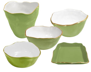 The Encanto Green Serveware Collection by Beatriz Ball features bowls and plates with green enamel and elegant gold-toned accents.