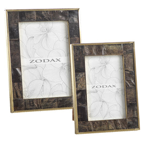 Two rectangular frames from the Zodax Natural Horn with Brass Trim Frame Collection feature unique horn patterns, brass trim, and floral line art placeholders with the word "ZODAX.