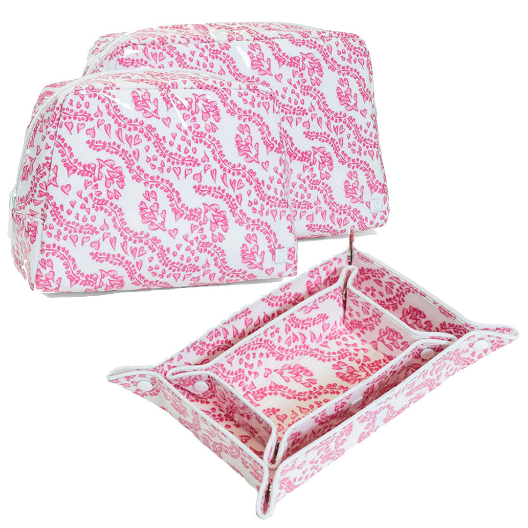 The Luxe Gloss All Heart Travel Set by TRVL Design in Kelly Pink includes two pink and white zippered pouches and a matching snap-button tray, ideal for organizing travel essentials. Shown on a white background.