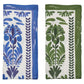 The Botanica Napkin Set by Kim Seybert features two folded napkins with botanical prints—one blue with purple, the other green with dark green on white—ideal as vintage-inspired table décor or elegant floral print linen napkins.