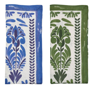 The Botanica Napkin Set by Kim Seybert features two folded napkins with botanical prints—one blue with purple, the other green with dark green on white—ideal as vintage-inspired table décor or elegant floral print linen napkins.