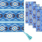 The Diamond Ikat Clearwater Table Linen Collection by Figue features a blue patterned table runner with a tasseled corner and four coordinating metallic blanket stitch napkins, ideal for a vibrant tablescape.