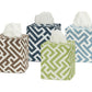 The Gabriel Tissue Box Cover Collection by Matouk features four square covers with geometric patterns in brown, navy blue, green, and light blue—each a stylish touch for your bathroom decor.