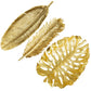 Three metallic gold leaves in various shapes and sizes from Michael Aram's New Leaves Serveware Collection are displayed on a white background, highlighting handcrafted, nature-inspired luxury home accents.