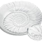 The Simon Pearce Shell Serveware Collection features large and small clear glass dishes with embossed spiral shell patterns—perfect for beach-inspired decor or a unique summer host gift.