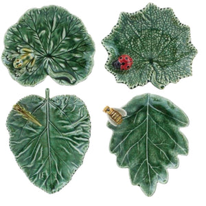 The Bordallo Pinheiro Countryside Leaves Dish Collection includes four green earthenware catchall dishes, each with a unique insect—frog, ladybug, dragonfly, and bee—for a playful touch to your home decor.