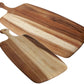 Two Be Home Acacia Wood Rectangular Board with Handle Collection boards of different sizes overlap on a white background.