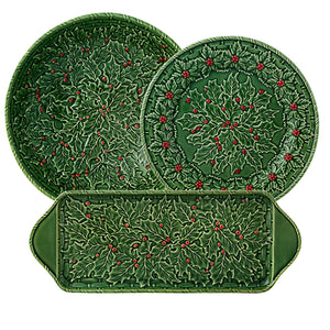 The Hive Holly Serveware Collection features three green ceramic dishes with embossed holly leaves and red berries—two round plates and a rectangular tray—perfect for festive holiday table settings.