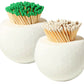 Two round white containers from the Tart by Taylor Golf Match Striker Collection hold matches—one with green tips, one with white tips.