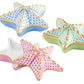 The Herend Starfish Box Collection features three ceramic star-shaped trinket boxes with removable lids in blue, green, and pink, each hand painted with gold accents.
