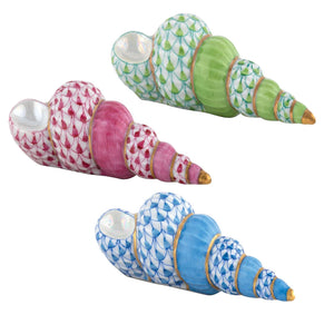 The Staircase Shell Collection by Herend features three durable porcelain seashell figurines, each hand painted with green, pink, or blue scale-like patterns and accented with gold on the tips and edges.
