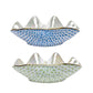 Herend’s Clam Shell Collection includes two white porcelain bowls with scalloped edges, each hand painted with geometric patterns—one in blue, one in green—for a decorative accent.