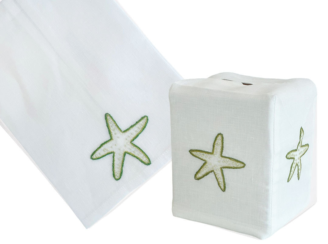 The Playful Starfish Bath Collection by Haute Home features a tissue box cover and towel set, hand embroidered on fine Italian linen with a delicate light green starfish design.
