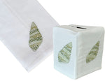 Haute Home's Speckled Conch Bath Collection in Green includes a white Italian linen hand towel and tissue box cover, both adorned with green seashell embroidery.