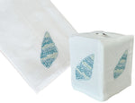 The Haute Home Speckled Conch Bath Collection in Aqua features a white Italian linen tissue box cover and matching towel, both hand embroidered with blue and aqua seashell designs.