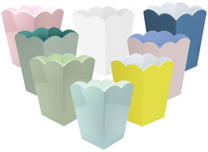 Eight pastel-hued scalloped-edge popcorn boxes—pink, green, yellow, blue, and white—are arranged on a white background, evoking the chic Addison Ross Scalloped Lacquer Waste Bin Collection.
