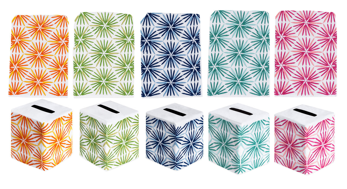 Ten tissue box covers from the Haute Home Radiant Bath Collection, crafted from premium linen and adorned with starburst patterns in vibrant orange, green, blue, teal, and pink—perfect for elevating your home décor. Shown in both front and top views.