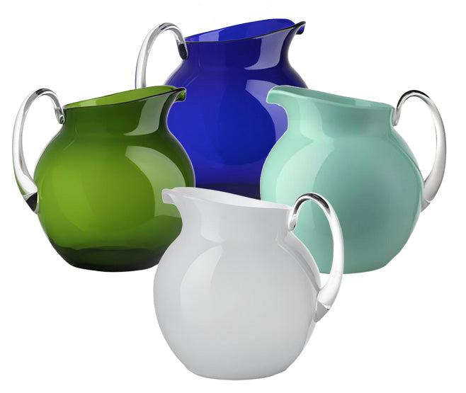 The Acrylic Palla Pitcher Collection by Mario Luca Giusti features four pitchers in green, blue, light blue, and white with clear handles, beautifully arranged together on a white background.