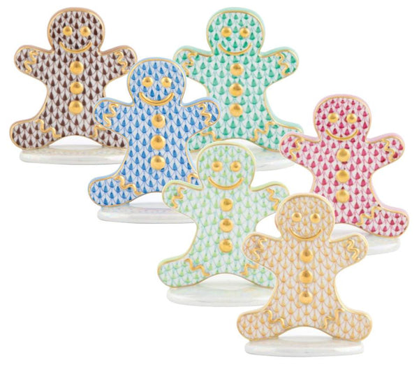 Herend Gingerbread Man Collection figurines from Herend, featuring colorful and decorative patterns, are arranged in two rows.