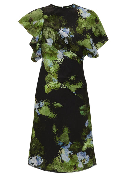 A knee-length Victoria Beckham Twist Shoulder Dress with a black base, featuring a green, blue, and light brown abstract pattern. The dress boasts short ruffled sleeves and an asymmetrical design on the upper part, completed with an asymmetric hemline for added flair.