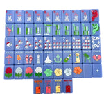 Bespoke x Gray Malin Mahjong Collection light blue tiles featuring colorful icons including beach items, flowers, and traditional Chinese characters.