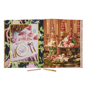 Open to "A Screaming Blast" by Rizzoli: left page shows a floral table setting with pink and gold details; right page displays a dessert table with retro desserts and candles, capturing a charming entertaining style.