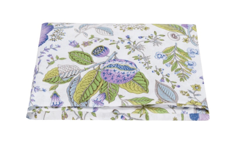 Folded fabric featuring a floral and leaf pattern with pastel colors on a white background, crafted from 100% Matouk linen.
