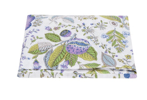 Folded fabric featuring a floral and leaf pattern with pastel colors on a white background, crafted from 100% Matouk linen.