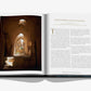 A copy of "Uzbekistan: Masterpieces of the Silk Road" by Assouline displays an article titled "The Mysterious Ancient Bactria" on the right page, accompanied by a photo of a historic, arched hallway on the left. This exploration into Uzbekistan's rich history reveals its significant role in the Silk Road and recent archaeological discoveries that uncover long-lost secrets.