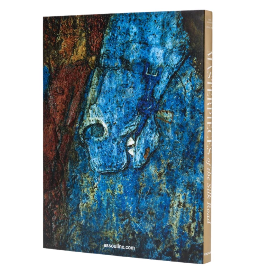 Uzbekistan: Masterpieces of the Silk Road," by Assouline, features a vivid abstract painting of a horse and explores the rich tapestry and archaeological discoveries along Uzbekistan's storied routes.