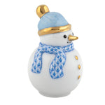 The Herend Snowman is a collectible porcelain figurine featuring gold buttons, a gold-tipped nose, a blue patterned scarf, and a blue hat with gold trim—a timeless accent for your winter décor.
