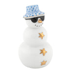 Herend’s “Tropical Snowman” is a porcelain figurine featuring gold star buttons, black sunglasses, and a blue-patterned hat—bringing whimsical charm to your holiday décor or beach-themed decorations.