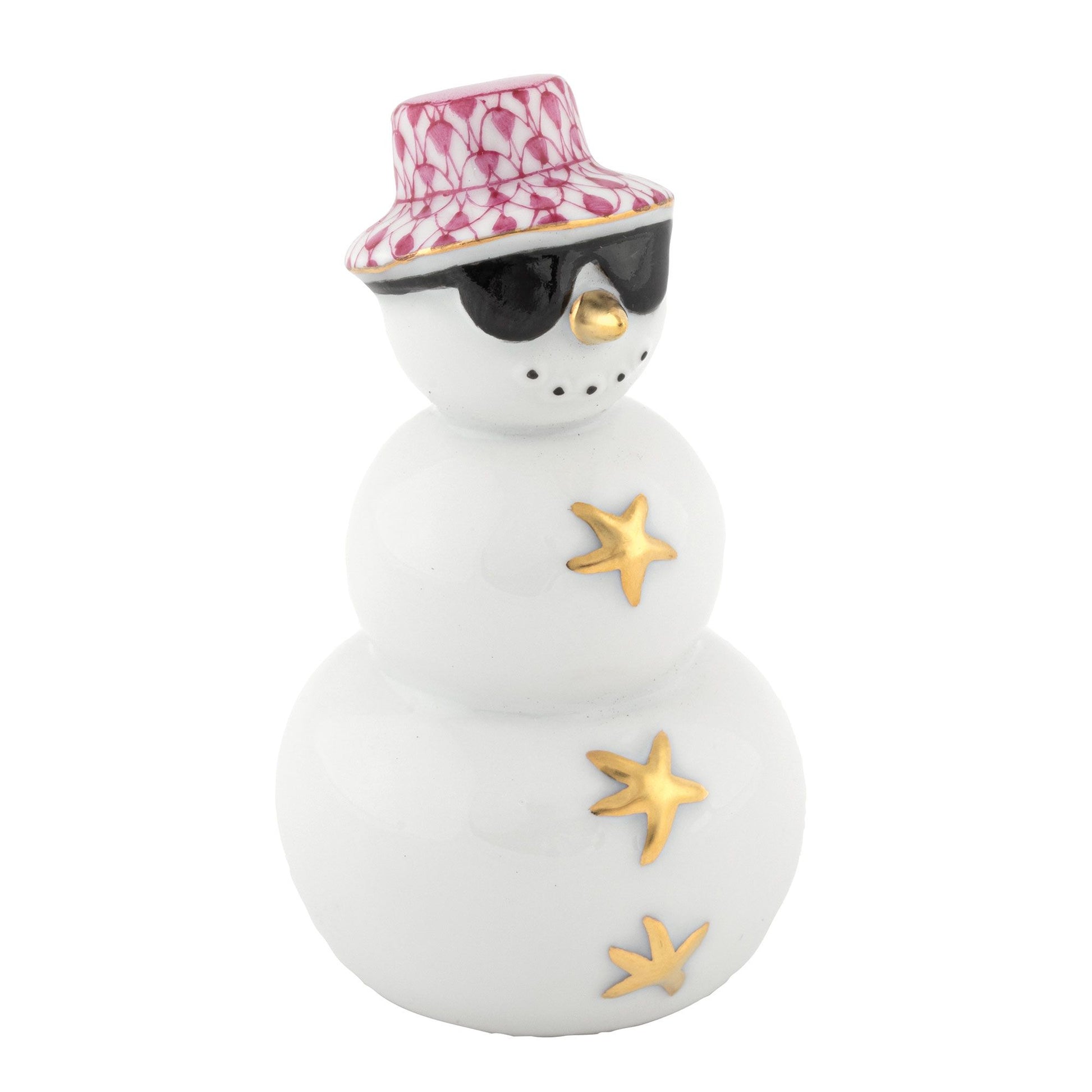 Herend’s Tropical Snowman figurine features porcelain craftsmanship with gold star buttons, a pink patterned hat, and black sunglasses, making it a perfect choice for unique holiday décor or as a playful beach-themed decoration.