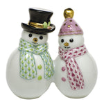 Herend Snowman Couple: Two charming ceramic figurines—one snowman sporting a black top hat and green scarf, the other in a pink hat and scarf—stand side by side, making them a perfect addition to your holiday décor and celebrating winter traditions.