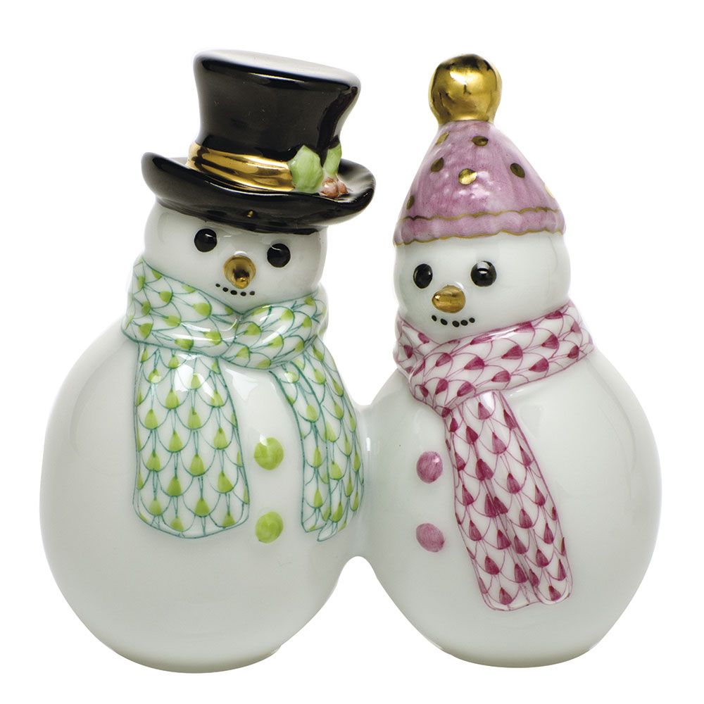 Herend Snowman Couple: Two charming ceramic figurines—one snowman sporting a black top hat and green scarf, the other in a pink hat and scarf—stand side by side, making them a perfect addition to your holiday décor and celebrating winter traditions.