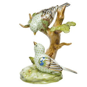 The Herend Reserve Collection "The Rothschild Birds" figurine features two green birds with patterned wings perched on a small tree, perfect for any songbird collectible lover.