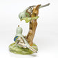 Herend Reserve Collection The Rothschild Birds figurine features two songbirds perched on a branch, one looking up, the other down, in green, blue, and brown. A charming limited edition collectible for any collection.