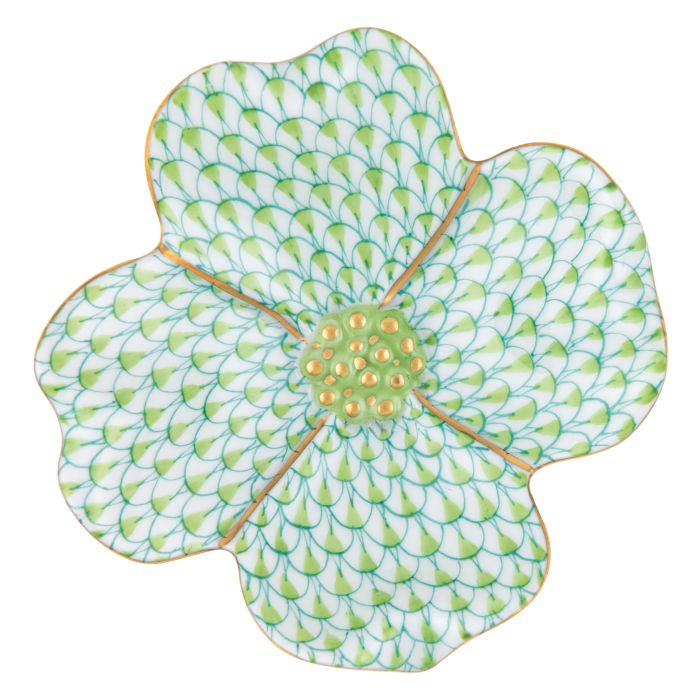The Herend Dogwood Flower by Herend is a floral-shaped plate with hand-painted designs, featuring a green scale-like pattern, a yellow center, and elegant gold trim.