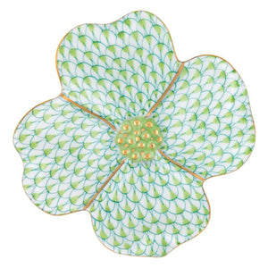 The Herend Dogwood Flower by Herend is a floral-shaped plate with hand-painted designs, featuring a green scale-like pattern, a yellow center, and elegant gold trim.