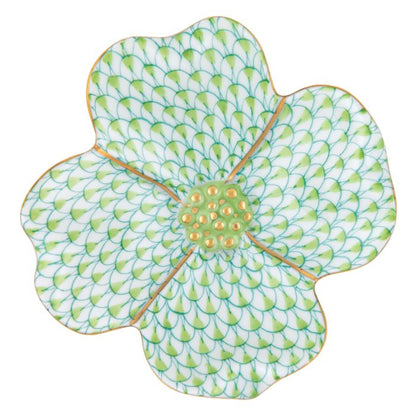 The Herend Dogwood Flower by Herend is a floral-shaped plate with hand-painted designs, featuring a green scale-like pattern, a yellow center, and elegant gold trim.