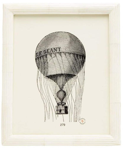 Black and white sketch of the "LE GEANT" hot air balloon, hand-etched detail and basket, displayed in a light wood Velden Frame Collection by Pigeon & Poodle—an elegant foyer accent capturing natural beauty.