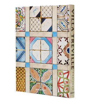 The Assouline "Villa Treville Positano" book features a cover adorned with a vibrant grid of decorative tile patterns in assorted styles and hues, capturing the elegance and allure of the iconic Amalfi Coast boutique hotel.