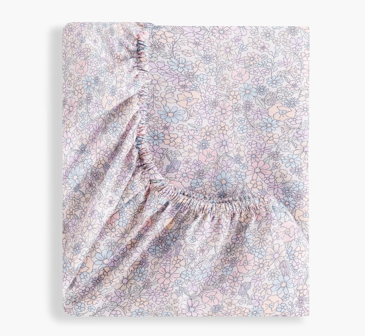 The Gooselings Enchanted Wildflowers Crib Sheet, featuring a pastel floral pattern and elastic edges, OEKO-TEX certified, is shown folded on a plain white background.