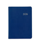 The Graphic Image 2026 Weekly Journal Planner Collection features a blue leather notebook with "2026" embossed in gold, shown on a white background—ideal for scheduling with dedicated appointment pages.